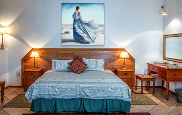 Print of Oil Color: Woman in Blue Long Dress Standing in a Windy Desert with Her Backside Shown